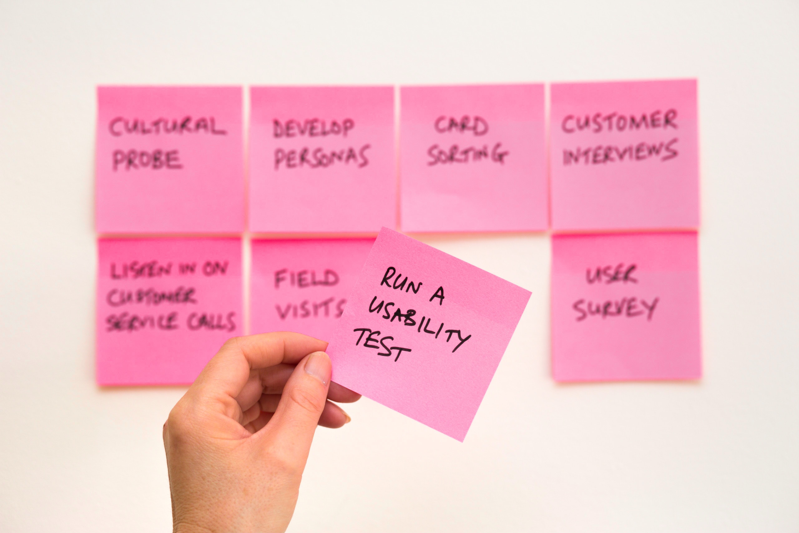 pink sticky notes and one says run a usability test